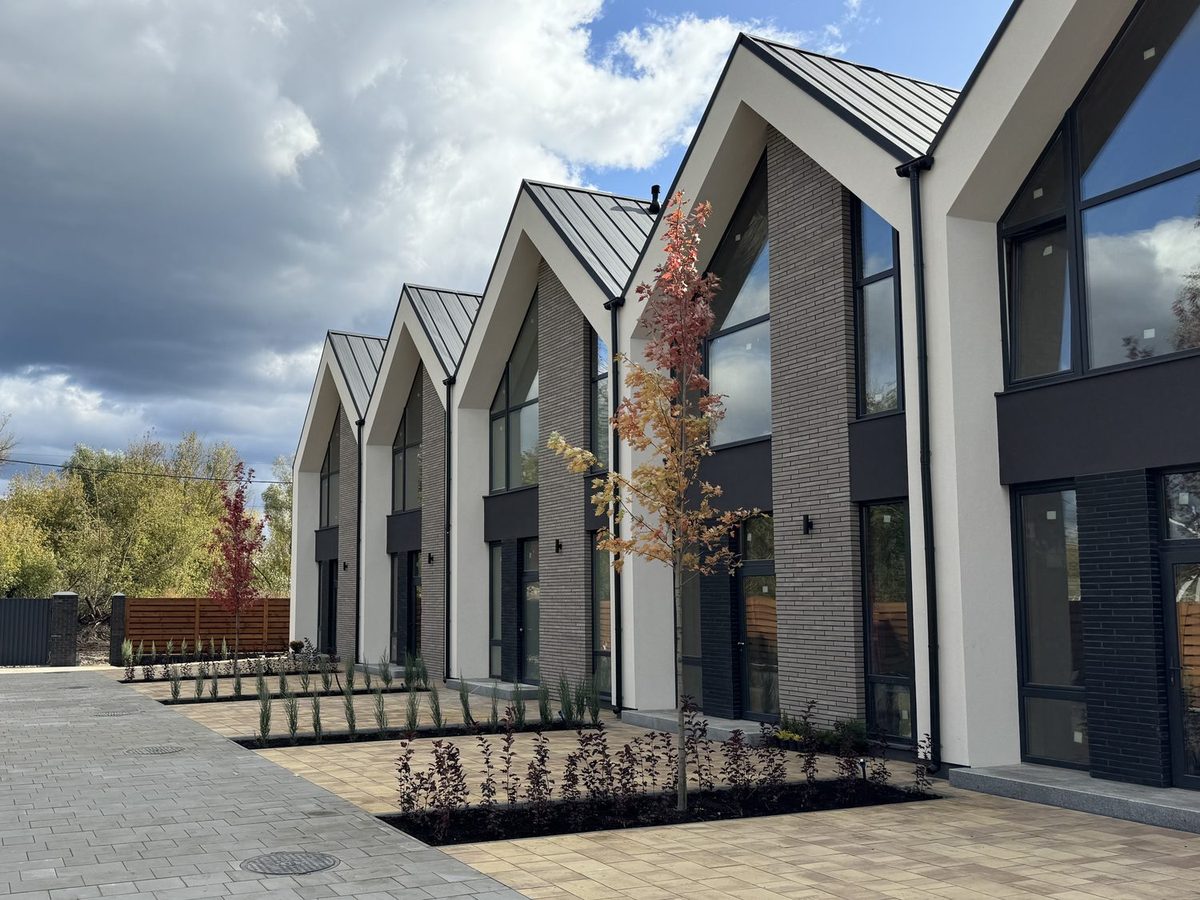 Completed townhouse development with brick facades.