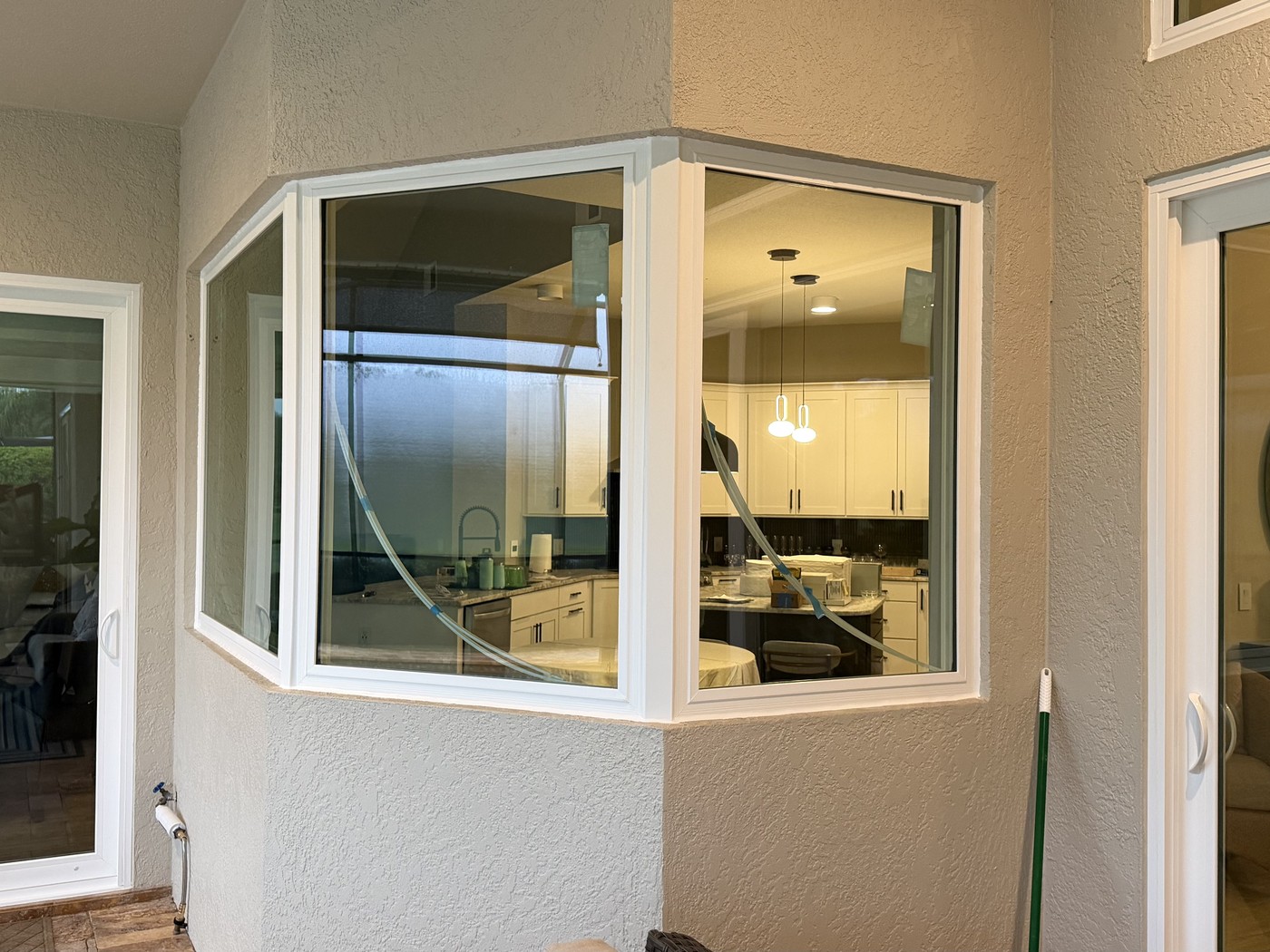Finished kitchen bay window with a water view.