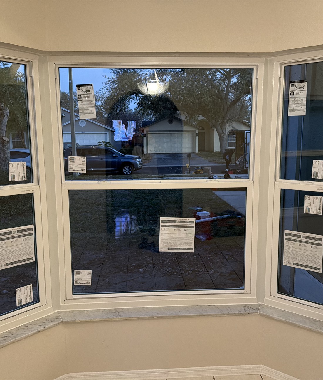 Finished bay window installed on a two-story home exterior.